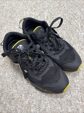 New Balance Men's Black Athletic Shoes with Yellow Highlights